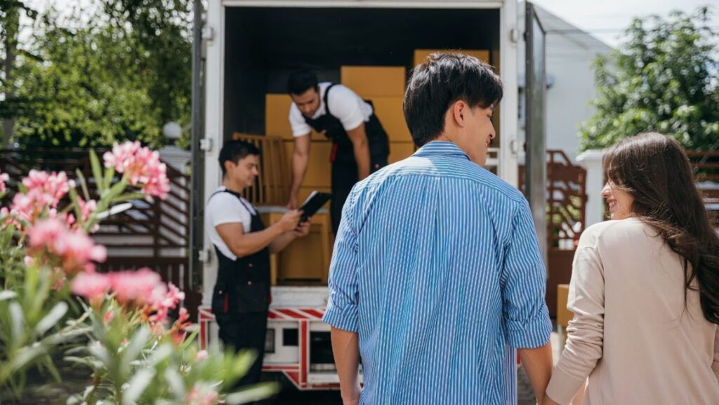 A couple getting ready to tip their movers after a 2-hour move.